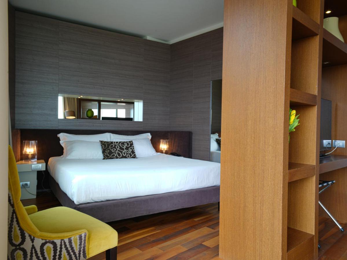 Pisa Tower Plaza Otel Dış mekan fotoğraf A bedroom at the hotel